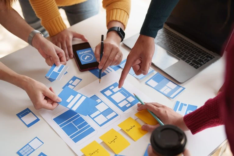 UX developers and UI designers brainstorming interface — Swonie UI/UX Design